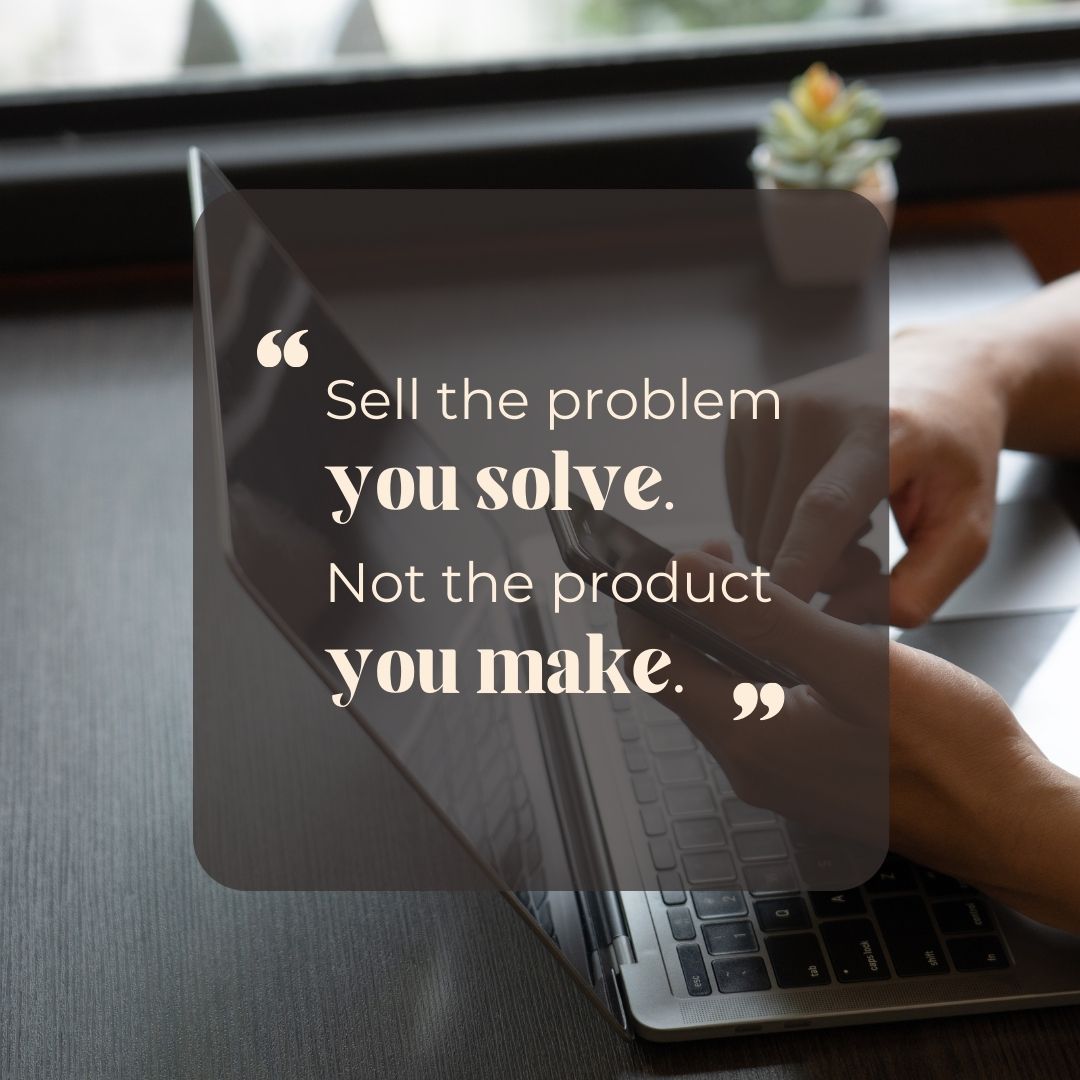 Image contains text in a blurred background: "Sell the problem you solve. Not the product you make"